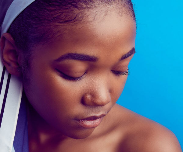 Dark skinned girl with headscarf