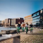 Eco-Friendly Commuting: Paving the Way for Sustainable Urban Travel #beverlyhills #beverlyhillsmagazine #carride #eco-friendlycommuting #hybridvehicles #publictransportation #urbantravel