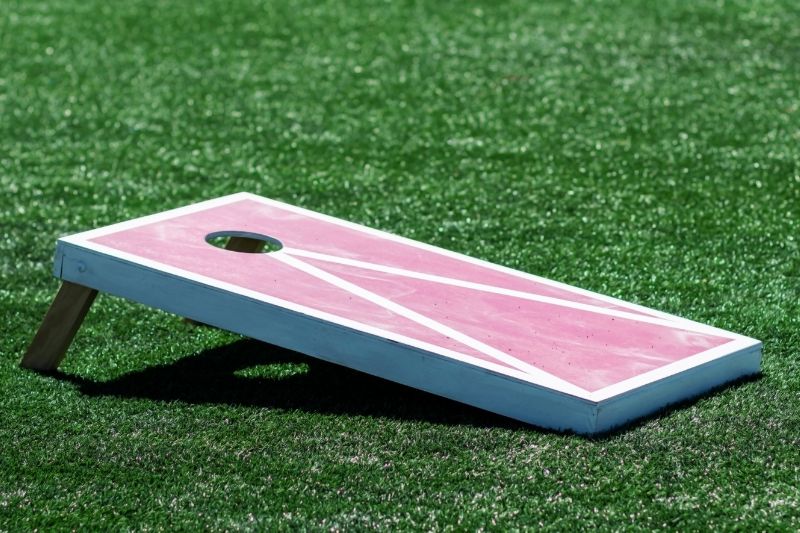 Top 6 Most Popular Cornhole Board Designs #beverlyhills #beverlyhillsmagazine #woodyboards #chevronpatterns #epoxyresin #epoxycoating #cornholeboarddesigns