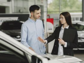 https://www.pexels.com/photo/woman-selling-car-to-client-in-salon-4895420/