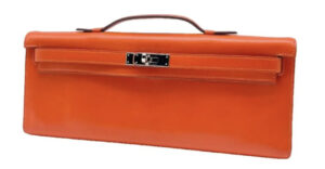 Hermes Orange Clutch Bag. BUY NOW!!! #bevhillsmag #beverlyhills #beverlyhillsmagazine #hermesorangebag #hermesbag #orangebag #bag #hermes