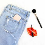 Denim Jeans With Gold iphone and Makeup Tools