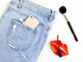 Denim Jeans With Gold iphone and Makeup Tools