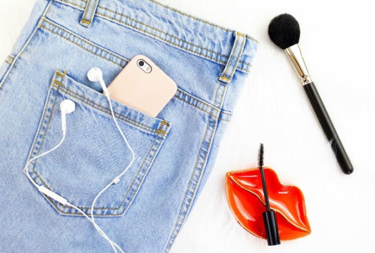 Denim Jeans With Gold iphone and Makeup Tools