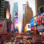 Busy Manhattan Street With Lots of People And Taxi Cabs