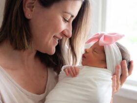 A Mother and a newborn baby girl - Top Recommended Nasal Aspirators for Parents #NasalAspirator, #BabyNoseSucker, #NoseFrida, #NozeBot, #BabyCongestion, #ElectricNasalAspirator, #Momcozy, #Grownsy, #BabyHealth2025, #ParentingEssentials